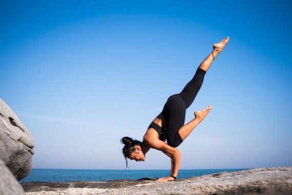 online yoga teacher doing a pose